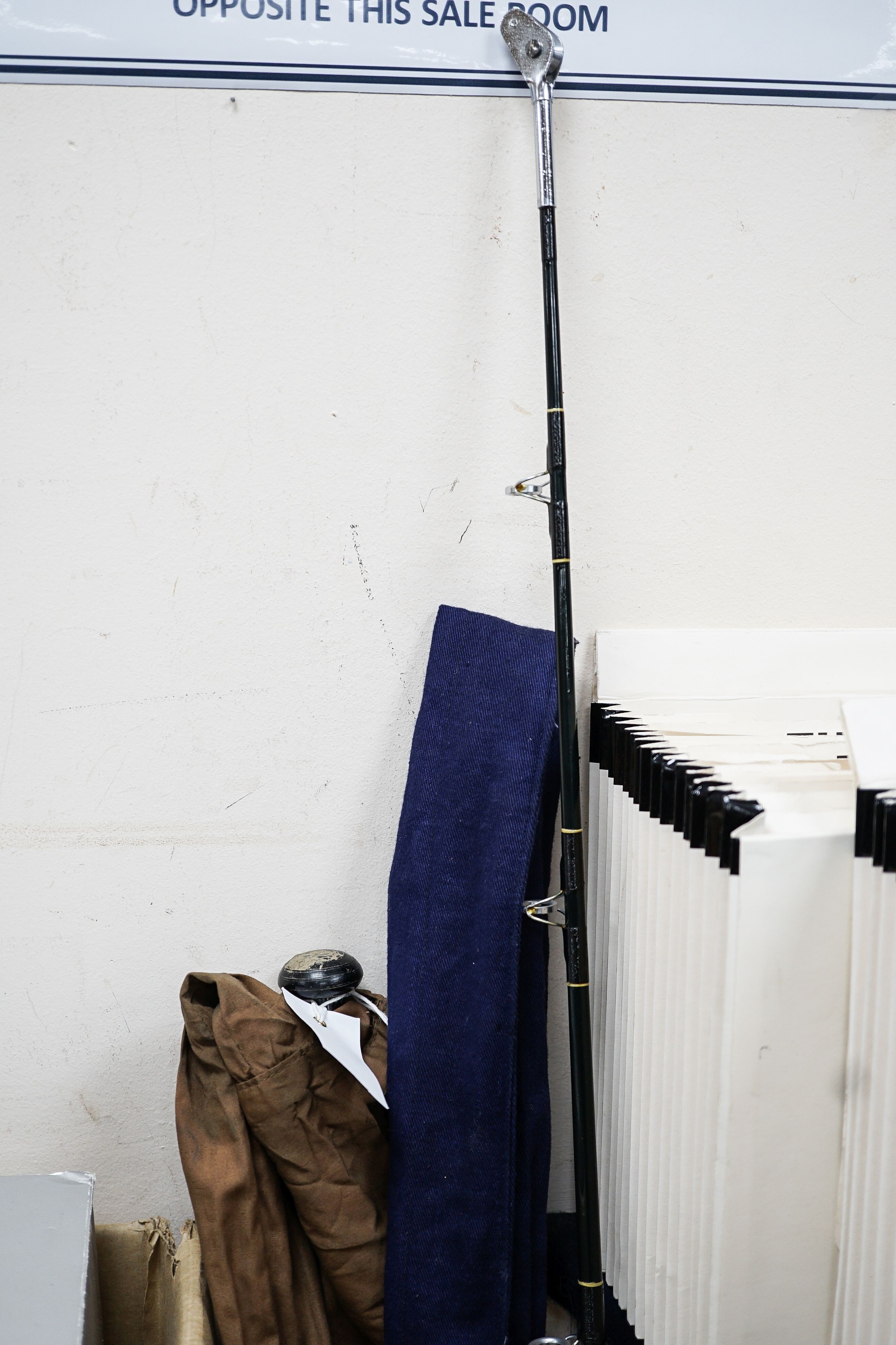 A Sealey octopus cane fishing rod and A Sealey carbon fibre rod, two others, reel and accessories